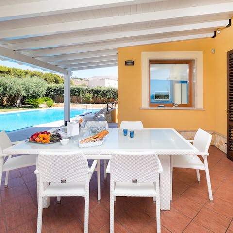 Settle down for homemade rigatoni on the cute outdoor table