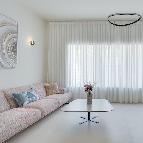 Unwind with a chilled beer in the bright and modern apartment