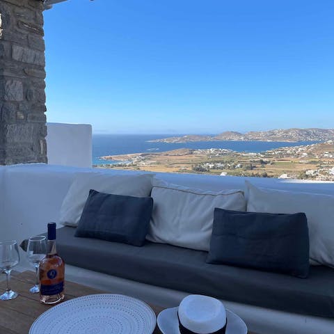 Sip on a glass of wine on the private balcony