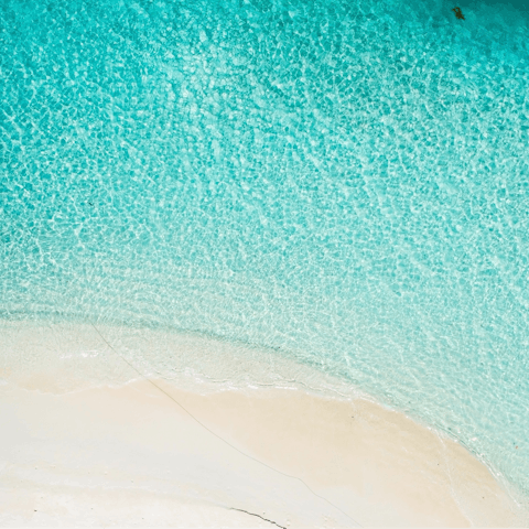 Soak up the sun from your building's private beach, a short walk away