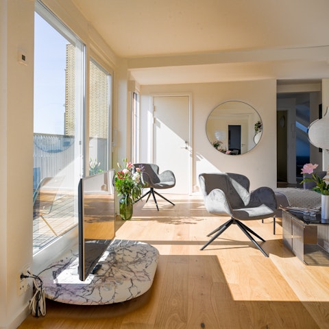 Come home after a long day of exploring and get cosy in the light-filled living space