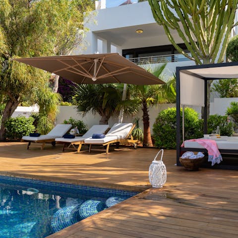 Enjoy a post-lunch siesta on the poolside day bed