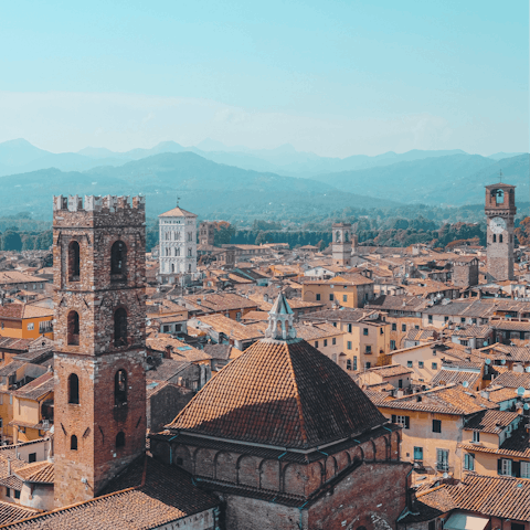 Stroll through the old town of Lucca, encircled with its mediaeval city walls