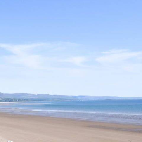 Head to the golden sands of Criccieth Beach,  just a fifteen-minute walk away