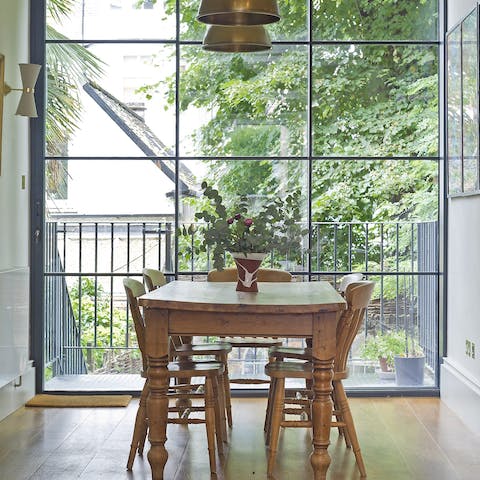 Enjoy a breakfast as sunlight pours in through the floor-to-ceiling window