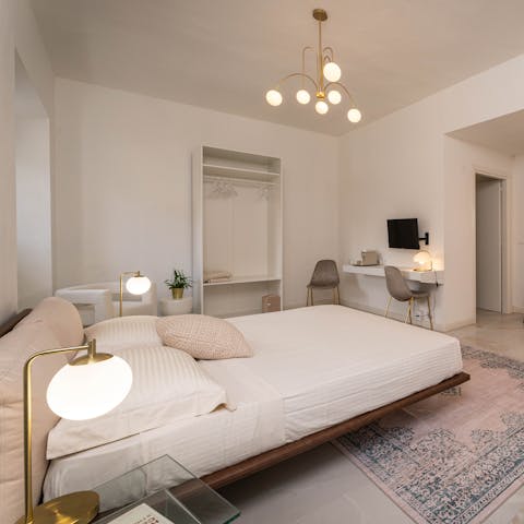 Wake up to sunlight and soft hues in one of the airy bedrooms