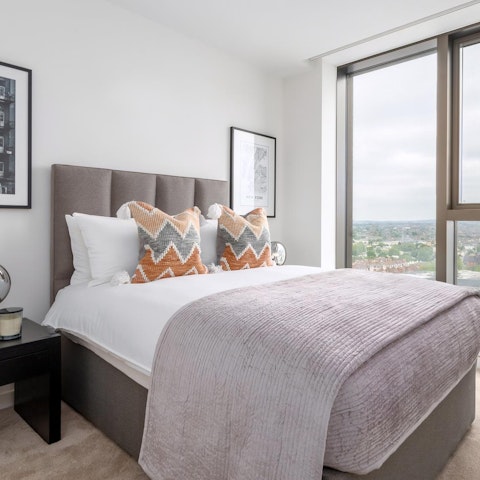 Admire the bedroom's view of the park