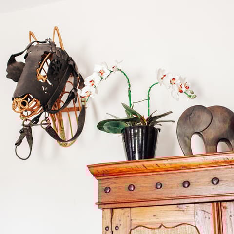 Admire antique pieces collected from the owner's travels in Asia