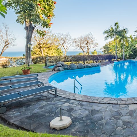 Cool off from the sun in the shared pool