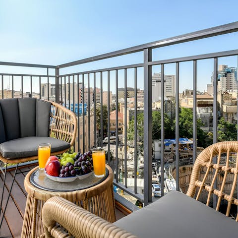 Savour your breakfast with views across the city