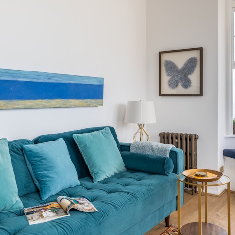 Sprawl out on the sumptuous blue sofa after a long walk along the coast