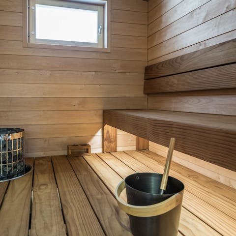 Unwind in the sauna as you sip on a glass of red