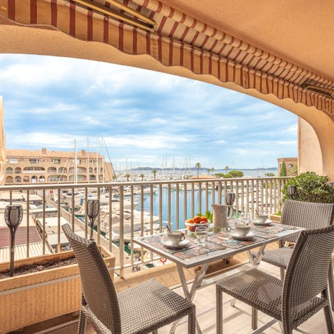Take in the wonderful views of the marina from the private balcony
