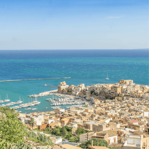 Explore the maritime town of Castellammare del Golfo – a six-minute drive away