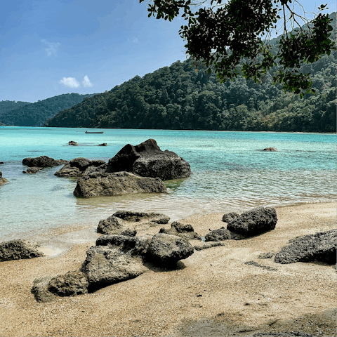 Visit the tranquil serenity of Surin Beach, just five minutes away from the apartment 