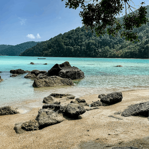 Visit the tranquil serenity of Surin Beach, just five minutes away from the apartment