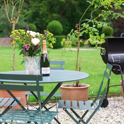 Light the barbecue and savour refreshing drinks in the garden