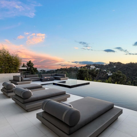Sprawl out on the loungers at sunset, Champagne in hand