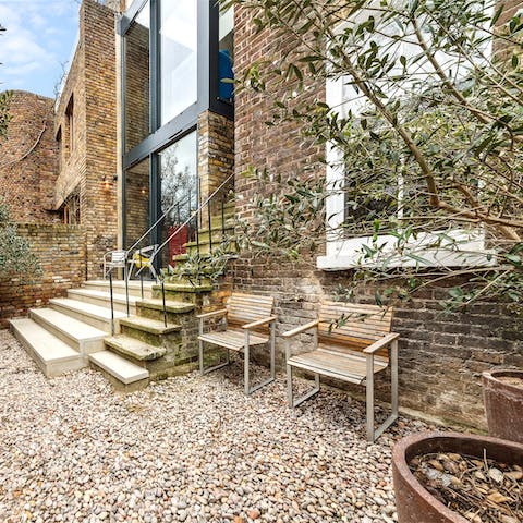 Sip a cup of coffee in the garden before starting your day