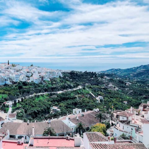 Wander the charming streets of Frigiliana with its picturesque white buildings