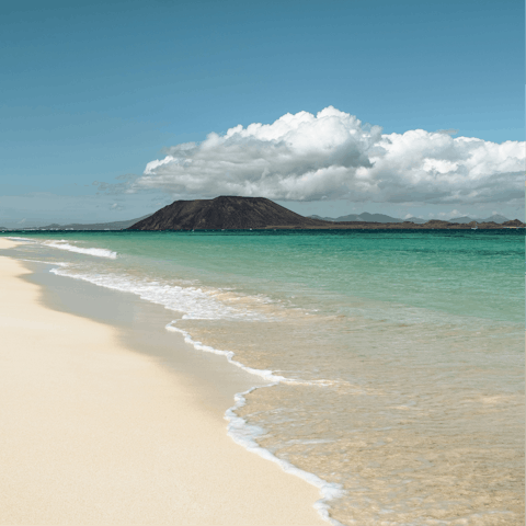 Sprawl out on Corralejo's sandy beach, just over 3km away