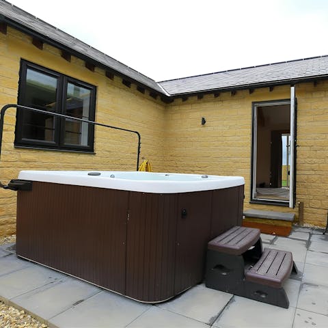 Relax in the Gloucestershire sun in the hot tub