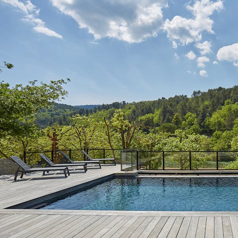 Relax on a lounger while admiring the surrounding countryside