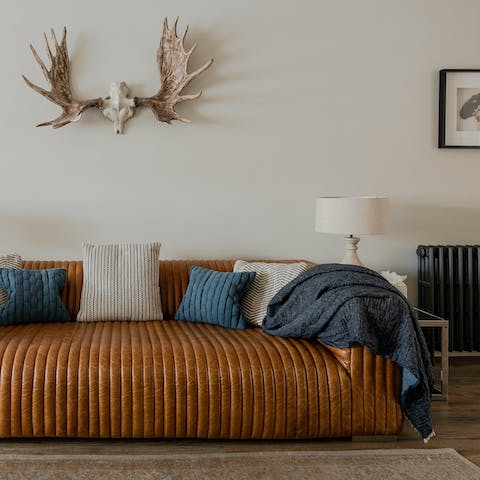 Sprawl out on the leather sofa and rest weary feet after exploring the village