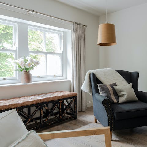 Relax in the charming window seat with a good book and a glass of wine