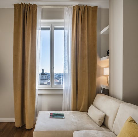 Gaze out over central Milan's rooftops from the living room window
