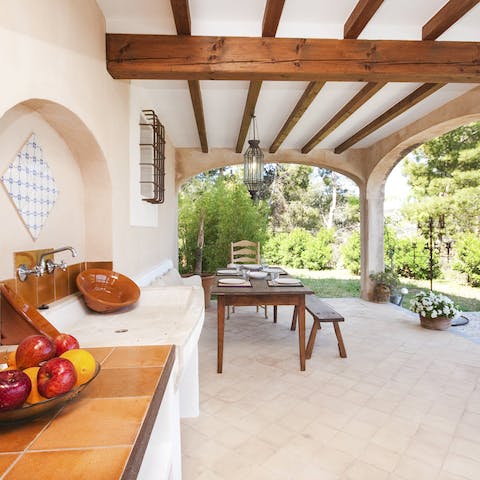 Enjoy a lunch of local produce prepared at the outdoor kitchen