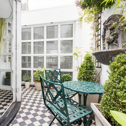 Watch the sky change colour while sat out in the home's leafy terrace