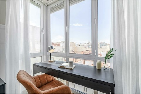 Work or read overlooking Madrid's skyline from a sun-filled corner
