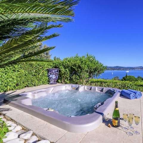 Soak in the hot tub with a glass of champagne, complete with a stunning view