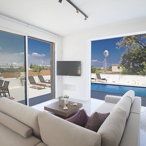 Escape the sunshine and kick back in the white-washed living area