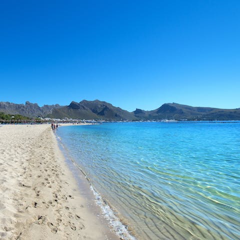 Soak up the sun from the sands of Platja del Port de Pollença, a short drive away