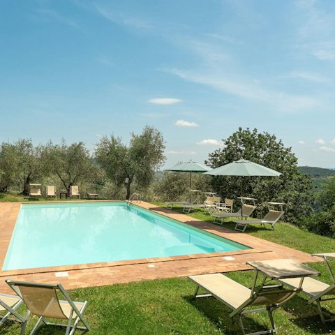 Spend carefree days stretched out by the pool
