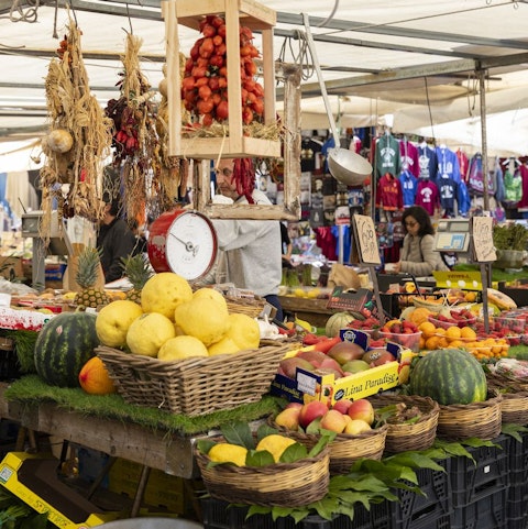 Peruse Piazza Campo de Fiori Market's fresh produce, an eight-minute stroll from your door