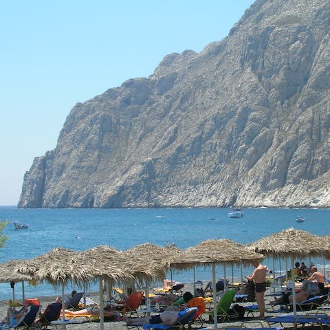 Cross over to the island's western side and enjoy a day at Kamari beach