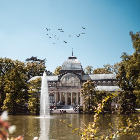 Visit El Retiro Park, a thirty-minute walk away