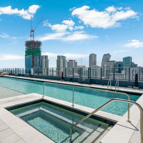 Hang out by the communal pool on a humid afternoon