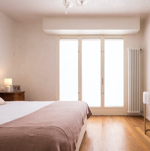 Wake up to sunlight streaming in through big double windows