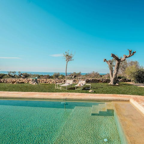 Float in the pool while admiring the sea views