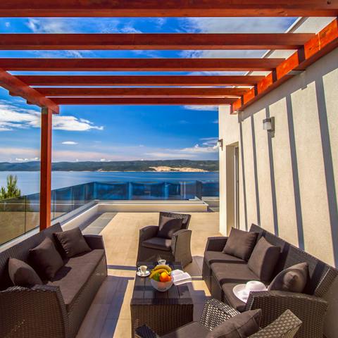 Savour your morning coffee on the comfy outdoor sofa set, chatting about the day's plan