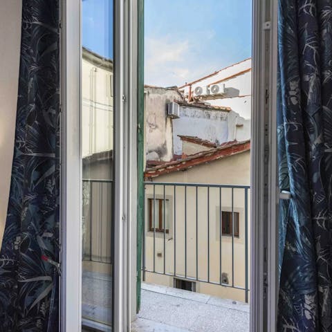 Take in the views over Florence's terracotta rooftops from the balcony