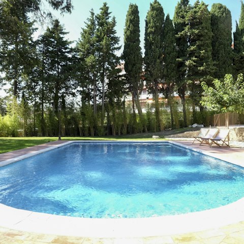 Cool off by diving into the glistening swimming pool on a hot summer day