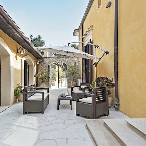 Share some arancini and Rioja wine on the outdoor chairs