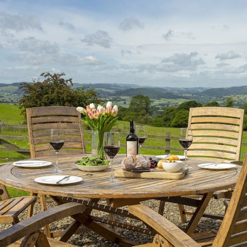 Admire the Shropshire Hills scenery over a glass of wine
