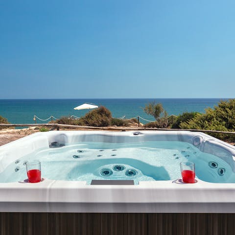 Admire the uninterrupted views whilst soaking in the hot tub