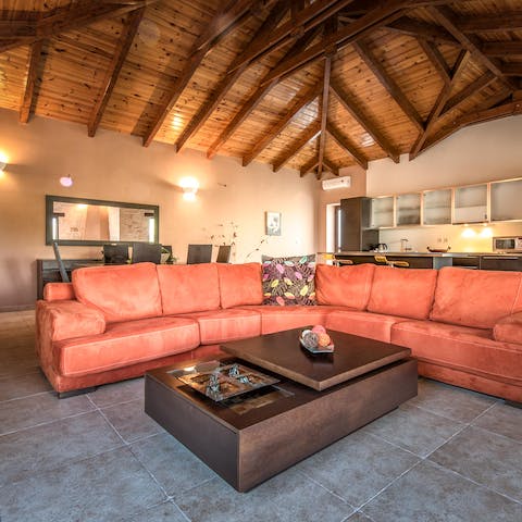 Cosy up on the huge corner sofa in the open living space